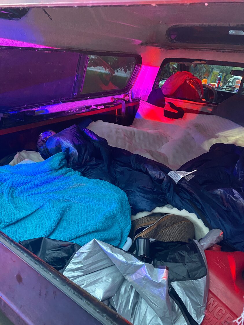 Belongings of both suspects including a makeshift bed, were found inside the stolen vehicle